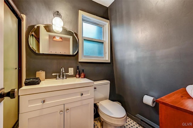 bathroom with vanity, a baseboard radiator, toilet, and tile patterned floors