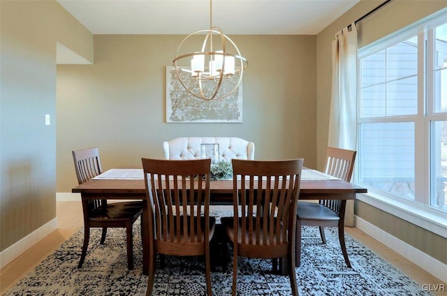 dining space with a chandelier