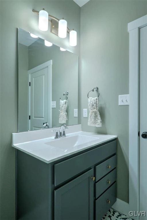 bathroom with tile patterned floors and vanity