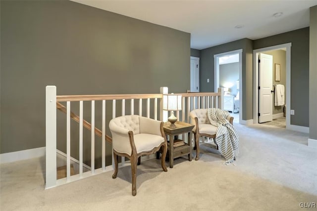 living area with light colored carpet