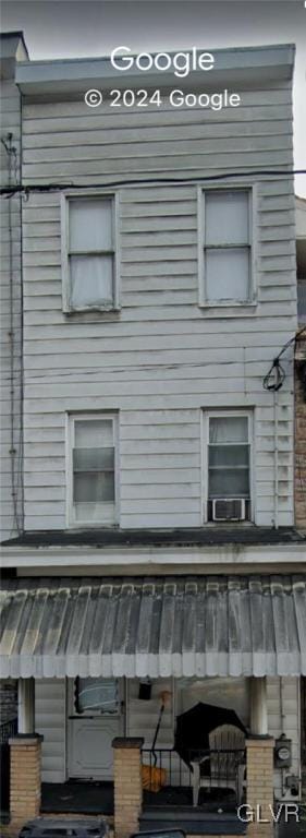 view of side of home featuring cooling unit