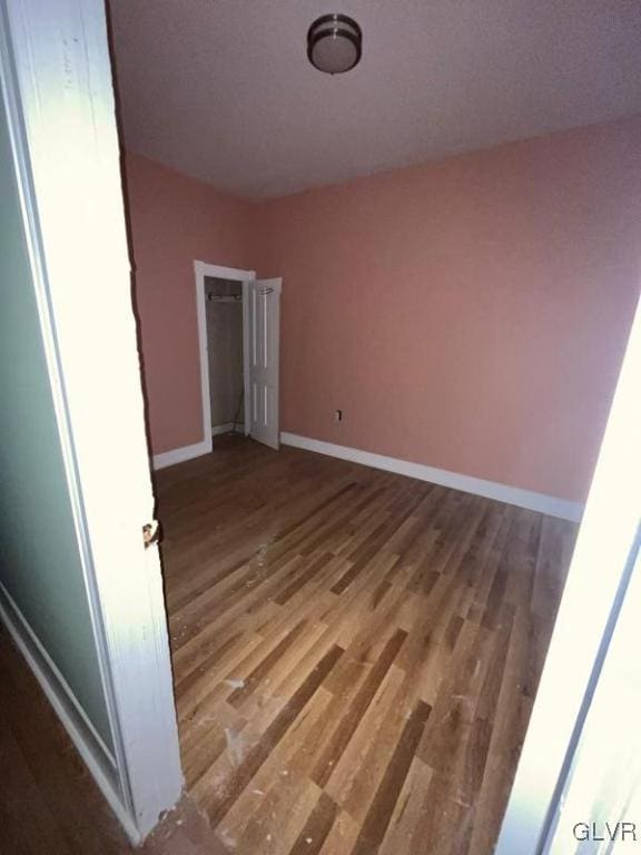 spare room featuring hardwood / wood-style floors