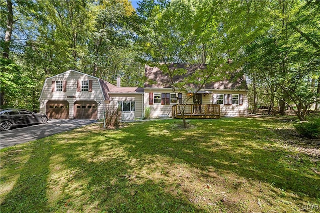 view of front facade featuring a deck and a front lawn