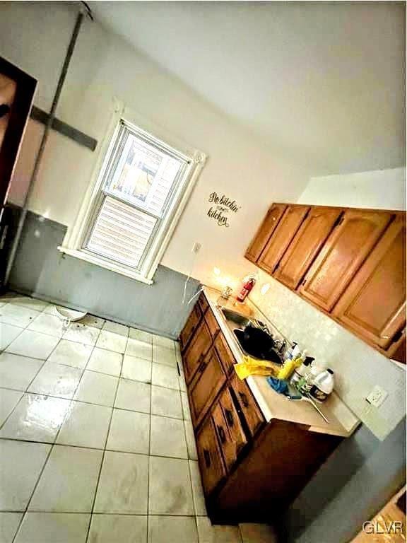 kitchen with light tile patterned flooring