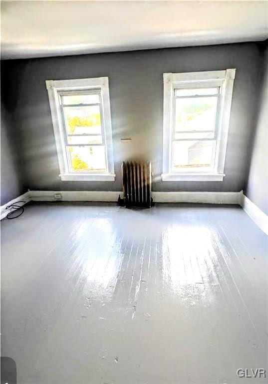 empty room featuring radiator heating unit