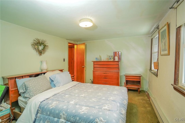 carpeted bedroom with baseboard heating and multiple windows