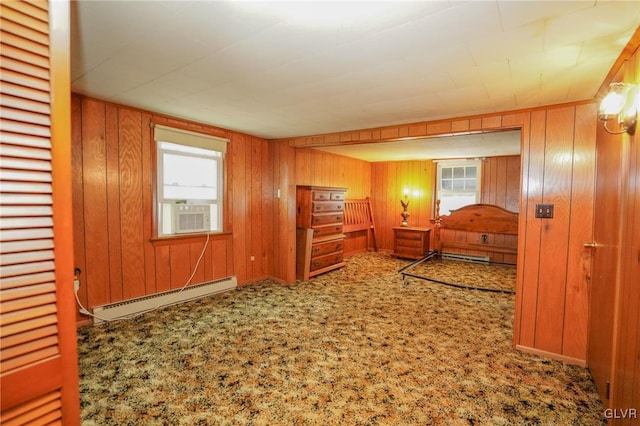 bedroom with a baseboard heating unit, carpet, multiple windows, and cooling unit