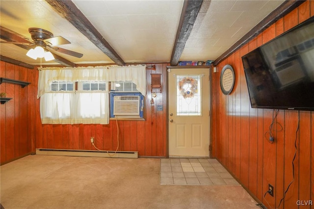 entrance foyer with ceiling fan, beamed ceiling, baseboard heating, and wood walls