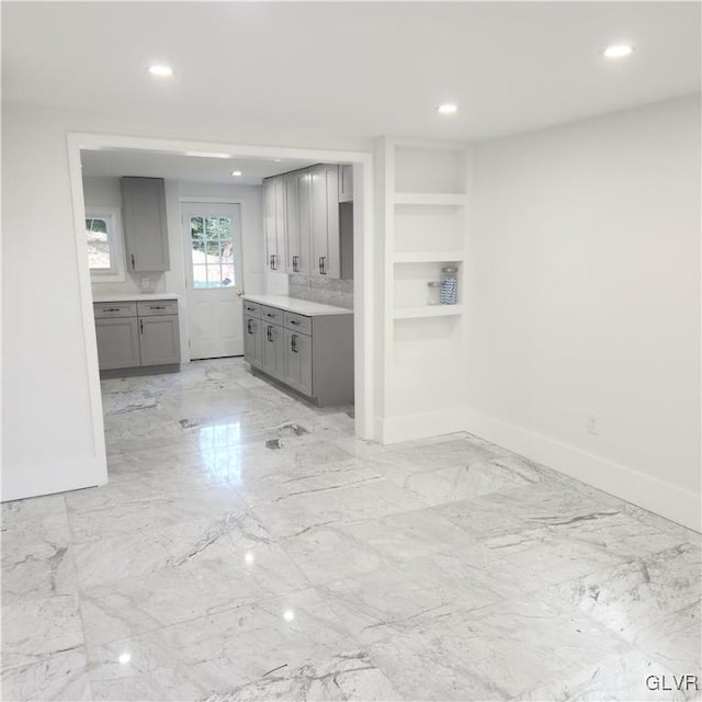 kitchen with gray cabinets and built in features