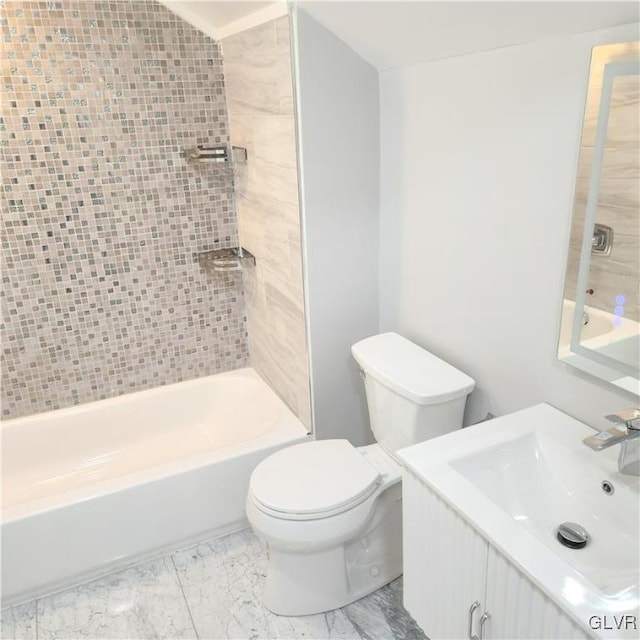 full bathroom with vanity, toilet, and tiled shower / bath