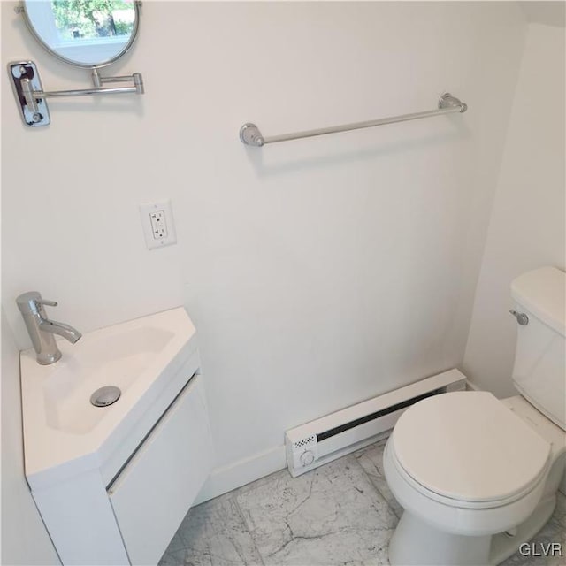 bathroom featuring toilet, a baseboard radiator, and vanity