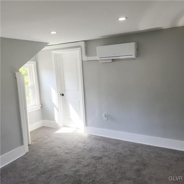 interior space featuring a wall unit AC and carpet flooring