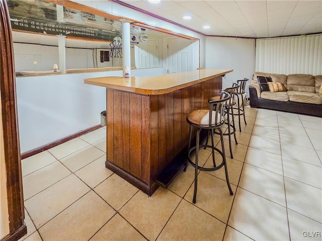 bar with light tile patterned floors