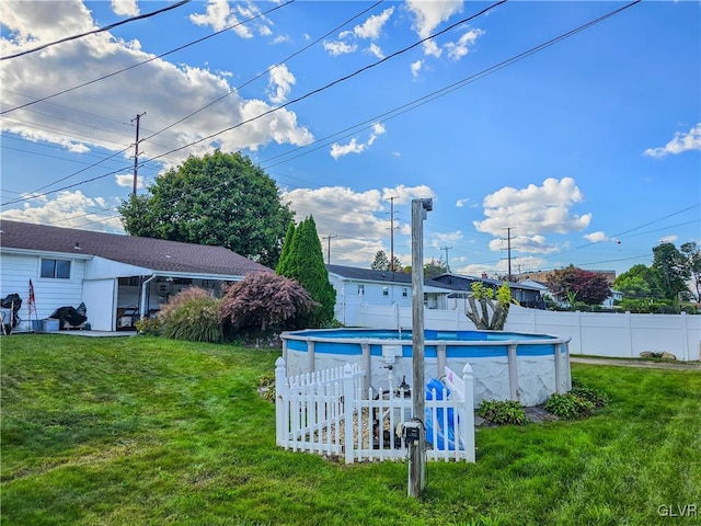 view of yard with a fenced in pool and a patio