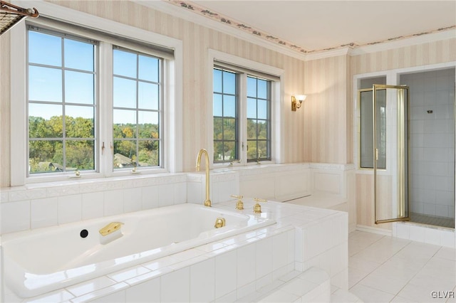 bathroom with separate shower and tub and tile patterned flooring