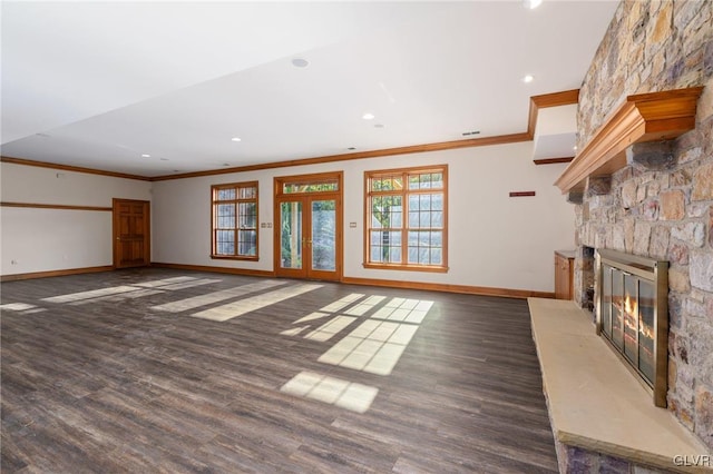 unfurnished living room featuring dark wood-type flooring, crown molding, and a fireplace