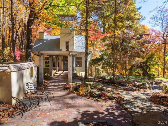 back of house with a patio area