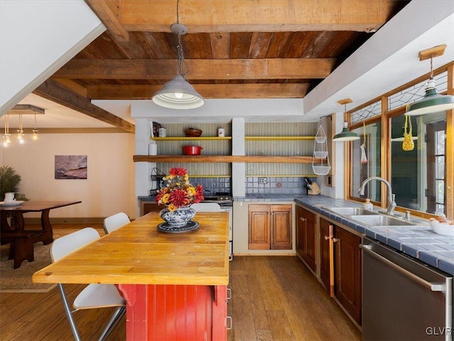 kitchen with tile counters, dishwasher, sink, beamed ceiling, and light wood-type flooring