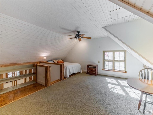 unfurnished bedroom featuring carpet, vaulted ceiling, and wood ceiling