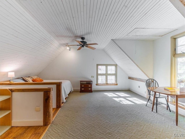 unfurnished bedroom featuring multiple windows, wood ceiling, lofted ceiling, and hardwood / wood-style flooring