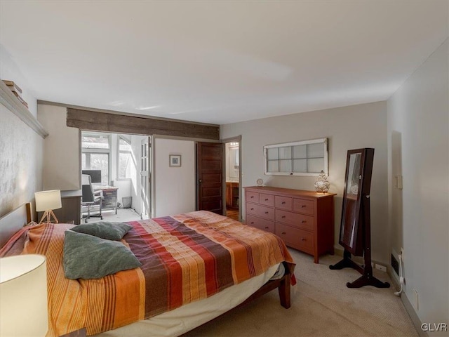 bedroom with light colored carpet