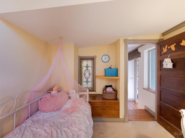 bedroom with light carpet