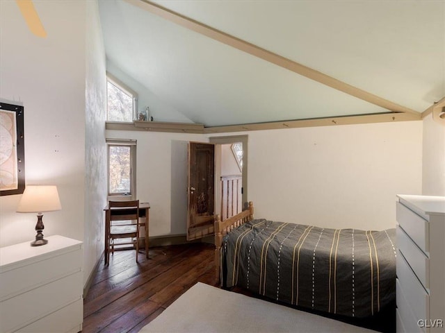 bedroom featuring dark hardwood / wood-style flooring and high vaulted ceiling