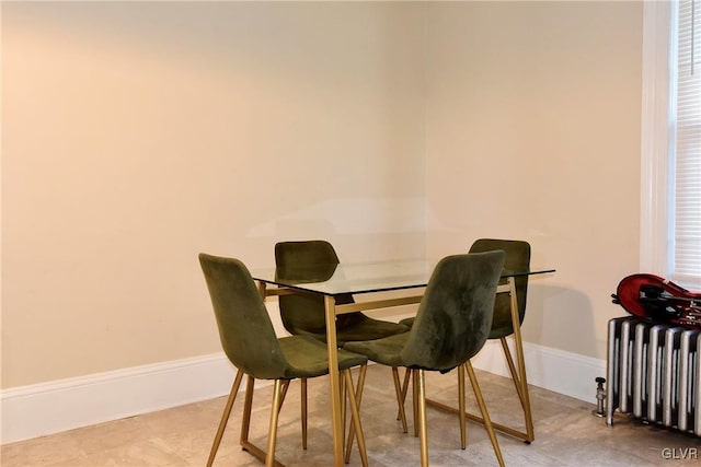 dining area featuring radiator