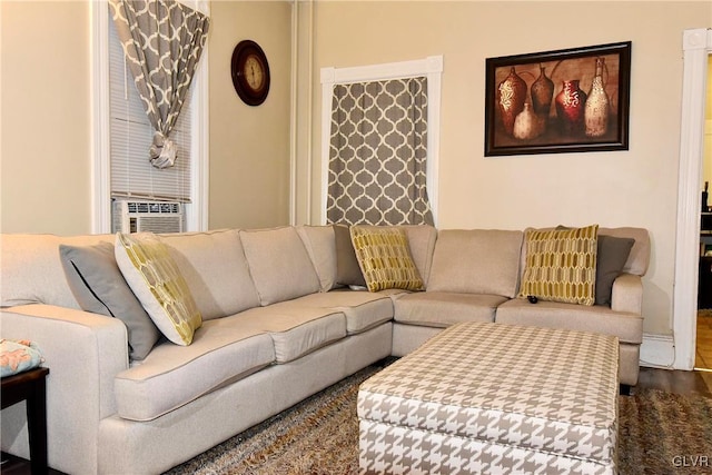 living room with cooling unit and hardwood / wood-style floors