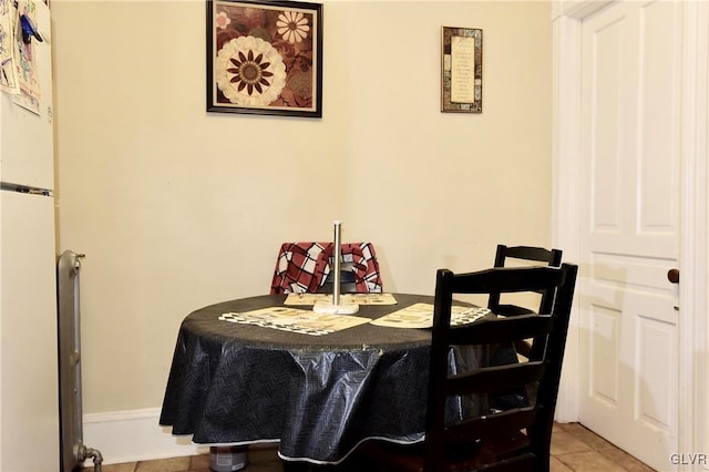 dining area featuring light tile patterned floors