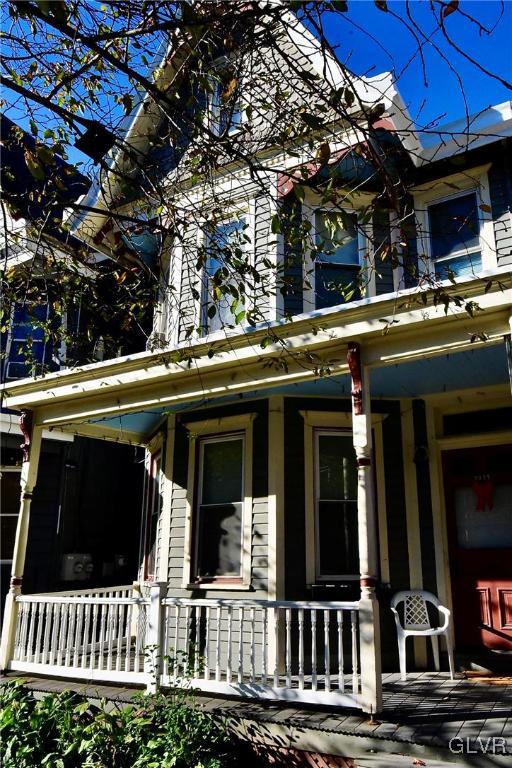 view of property exterior featuring a porch