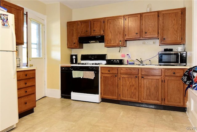 kitchen with white appliances and sink