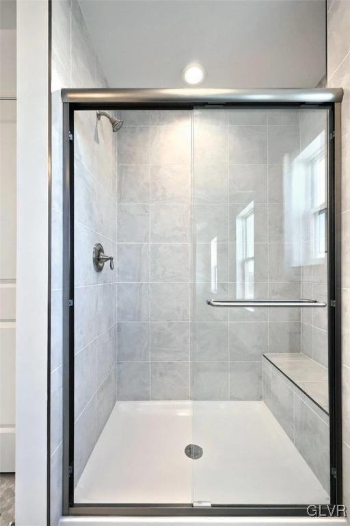 bathroom with a stall shower