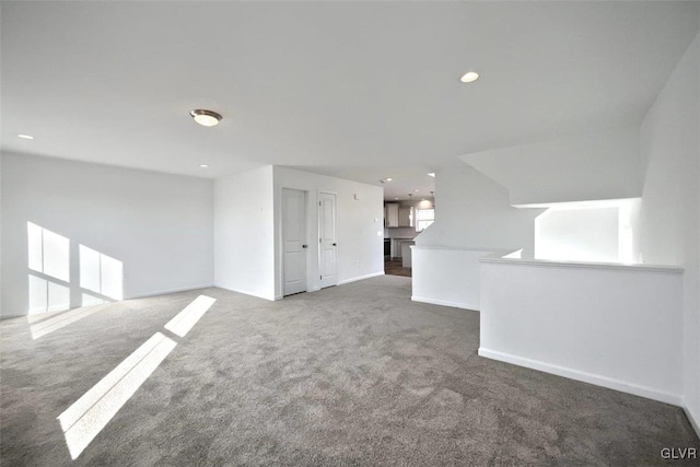 empty room with carpet flooring, recessed lighting, and baseboards