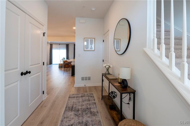 hall with light hardwood / wood-style flooring