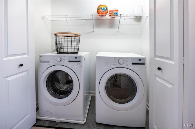 clothes washing area with washer and dryer