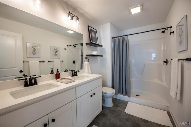 bathroom featuring curtained shower, vanity, and toilet