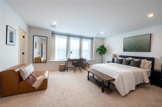 bedroom with light colored carpet