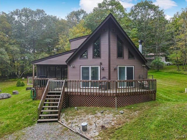 back of house featuring a yard and a deck