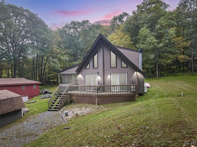 exterior space with a deck and a yard