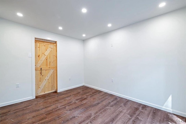 spare room featuring dark hardwood / wood-style floors