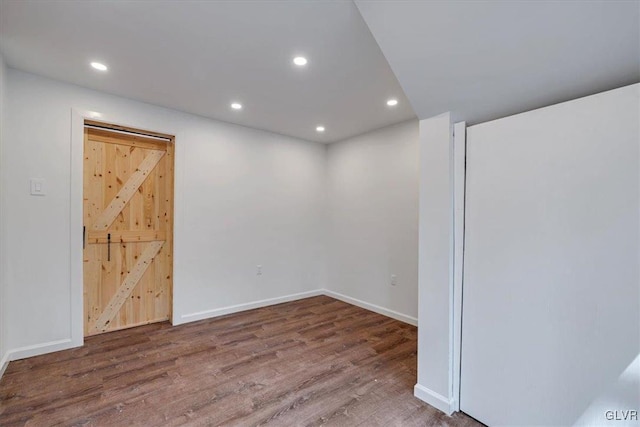 empty room with hardwood / wood-style flooring