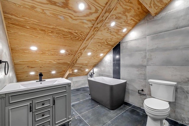 bathroom with vanity, tile walls, and toilet