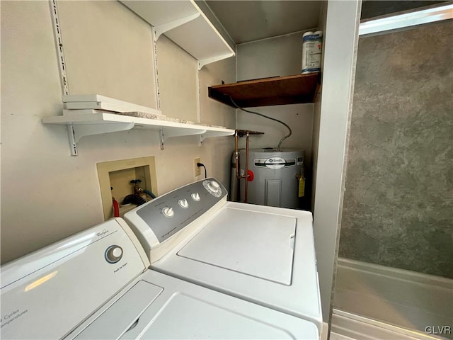 clothes washing area featuring independent washer and dryer and electric water heater