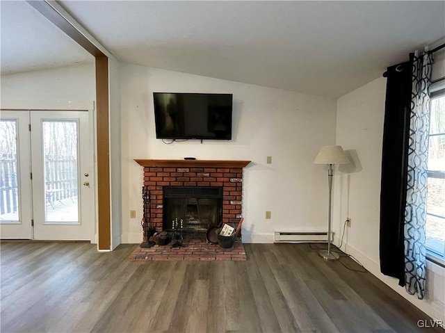 unfurnished living room featuring a fireplace, wood-type flooring, baseboard heating, and vaulted ceiling