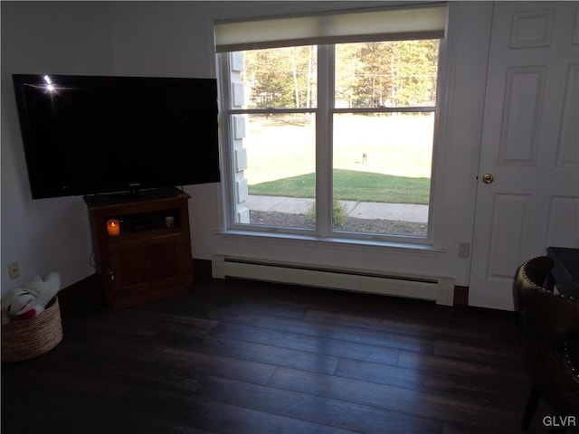 144 Dogwood Dr, Penn Forest Township, PA 18229 - living room with a baseboard heating unit, dark wood-style floors, and plenty of natural light
