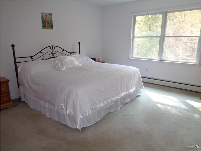 carpeted bedroom featuring a baseboard radiator