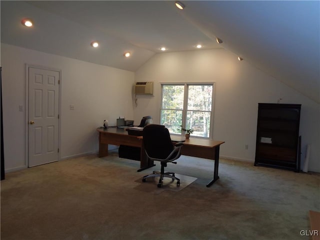 carpeted office space featuring vaulted ceiling