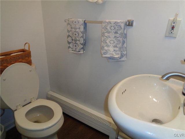 144 Dogwood Dr, Penn Forest Township, PA 18229 - bathroom with baseboard heating, a sink, and toilet