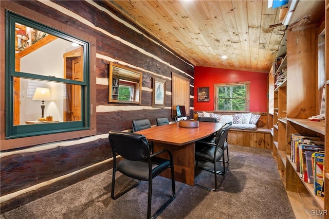 dining space featuring lofted ceiling, wooden ceiling, and wood-type flooring